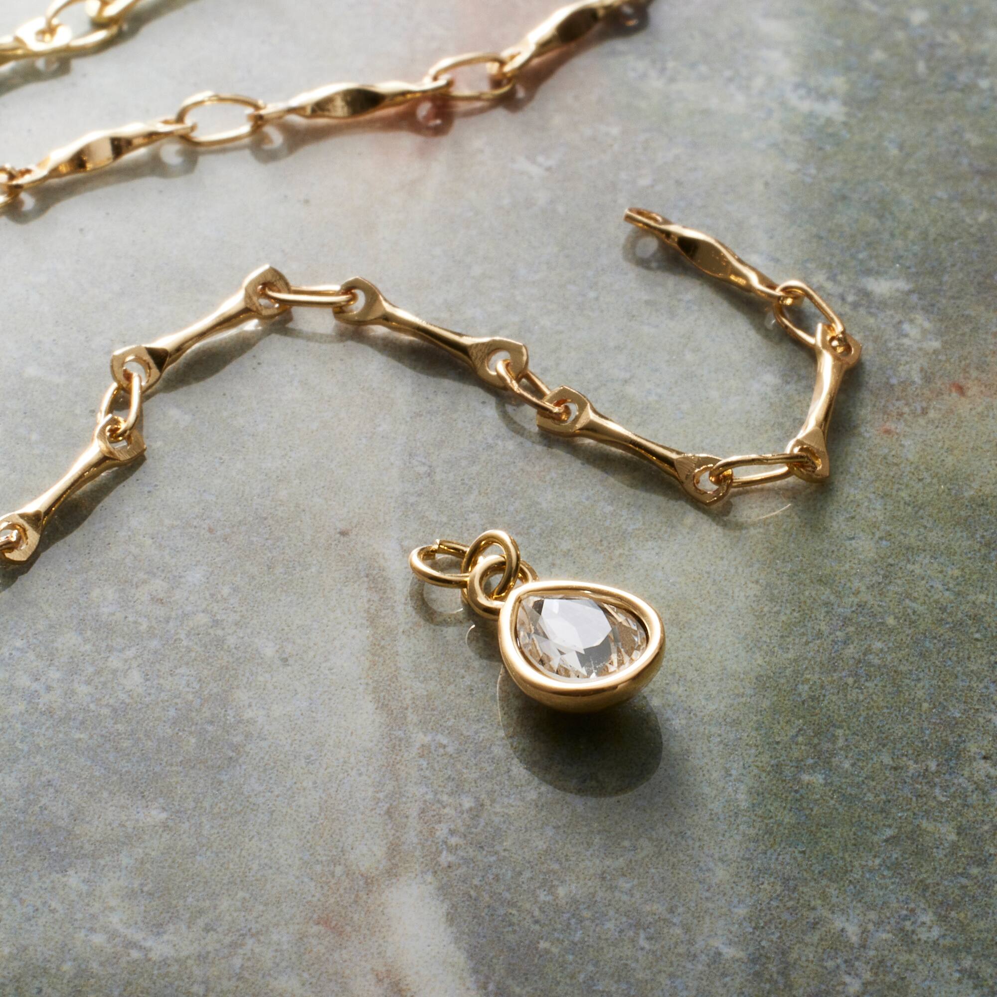 12 Pack: 14K Gold Plated Clear Austrian Crystal Pear Charm by Bead Landing™